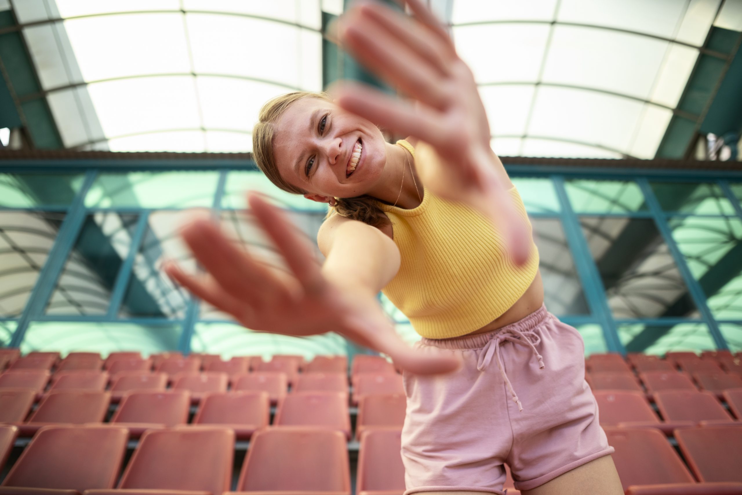 low-angle-smiley-woman-posing