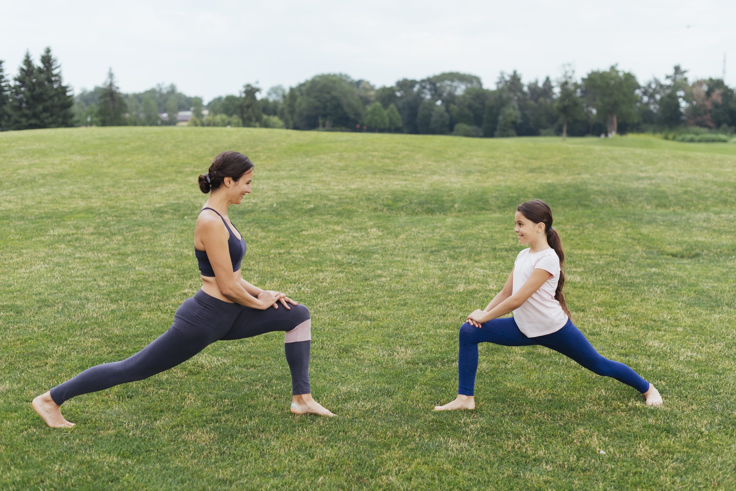 mother-daughter-stretching-outdoors